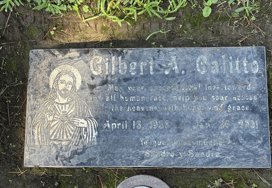 A headstone before Glory Roses cleaning